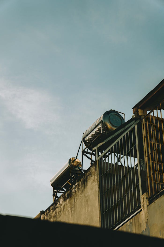 Sunset view of industrial tanks on a rooftop in Ho Chi Minh City, Vietnam.